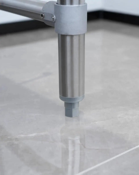 Workhorse Adjustable Bullet Feet For One And Five Eighths Inch Tubing On Industrial Kitchen Work Tables installed on floor