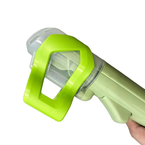 Little Green Machine brush attachment in lime-green plastic with clear housing.