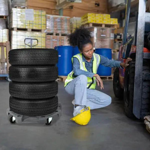 Heavy Duty Tire Dolly With 300 Pound Capacity Wheel Rack And Swiveling Casters Rolling Storage in a warehouse setting