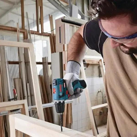 Man using 91 Piece Drilling And Driving Mixed Bit Set For Wood Metal And Masonry By Bosch With Driver Bits and Drill Bits