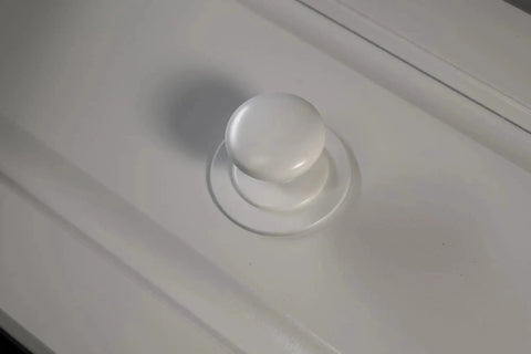Close-up of Two Pack XL White Bi Fold Closet Dummy Doorknob with Wide Backplate for Wardrobe Dresser Kitchen Cabinets