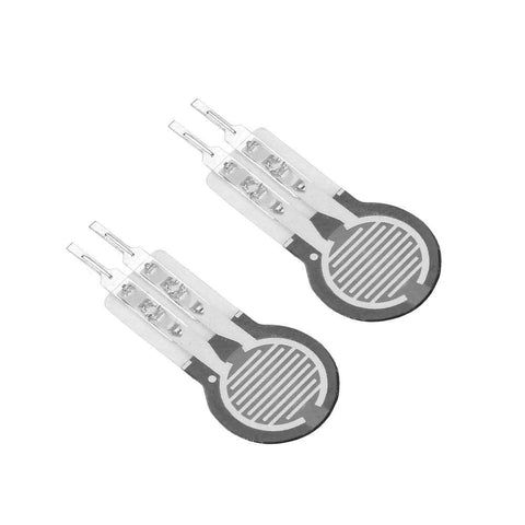 Two DF9-16 thin-film force sensing resistors with round gray discs and metal lead pins.