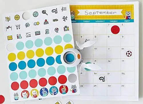 1 Inch Circle Squeeze Punch in white and navy blue on calendar with colored dots for card making and scrapbooking, easy punching