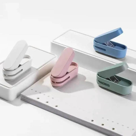 Compact Blue Hole Puncher For 10 Sheets Tiny Single Hole Puncher For Office with colorful options displayed on white background