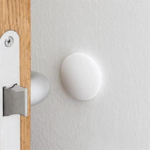 Three Piece Wall Doorstop Set With Self Adhesive Silicone Bumper Pads installed on wall protecting from door impact