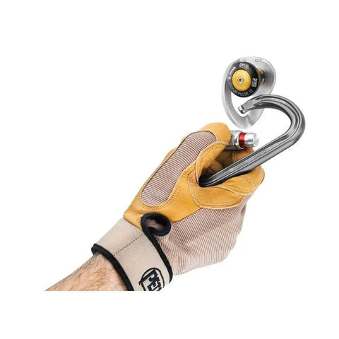 Gloved hand holding Petzl Coeur Pulse 12 Mm Removable Anchor With Locking Function for Secure Concrete Installations.