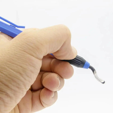 Hand holding Deburring Tool Set With Eleven High Speed Steel Swivel Blades And A 360 Degree Rotary Head for metal removal