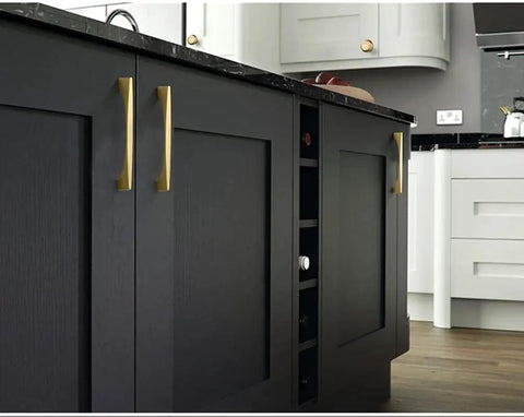4 Pack Brushed Gold Cabinet Drawer Pulls In Zinc Alloy With Brushed Brass Finish installed on black kitchen cabinet doors.