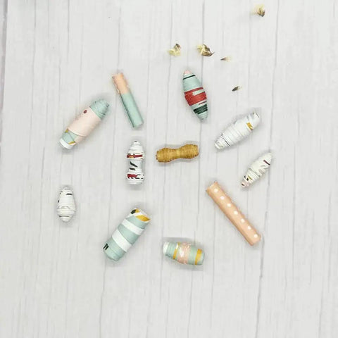 Large Paper Beads Maker Dies And Stencils For DIY Scrapbooking And Card Making, showcasing colorful paper beads on a wood table.