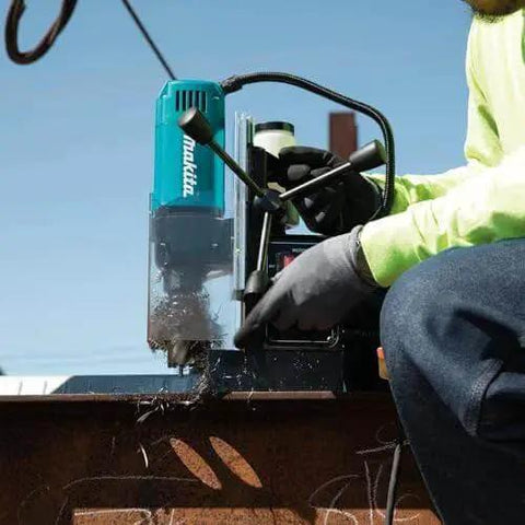 Portable Magnetic Drill For Steel With One And Three Eighths Inch Capacity And Two Inch Thick Cutting, A Real Workhorse With 850 RPM From A Ten Amp Motor, Lightweight And Compact For Tight Spaces, Removable Guard, Spindle Coolant System Makita HB350 in action on metal beam