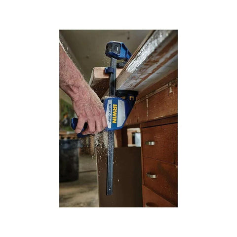One Handed Micro Bar Clamp Set For Woodworking With Non Marring Pads Quick Release Trigger Four And A Quarter Inch Throat in use clamping wood.