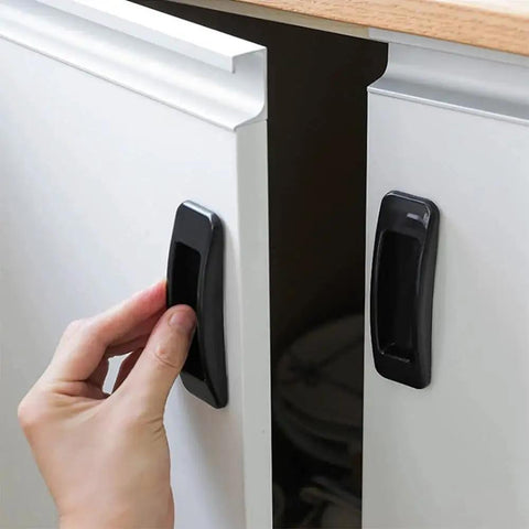 Person using Self Stick Instant Cabinet Drawer Handle Multipurpose Stick On Handle for easy opening on kitchen cabinet