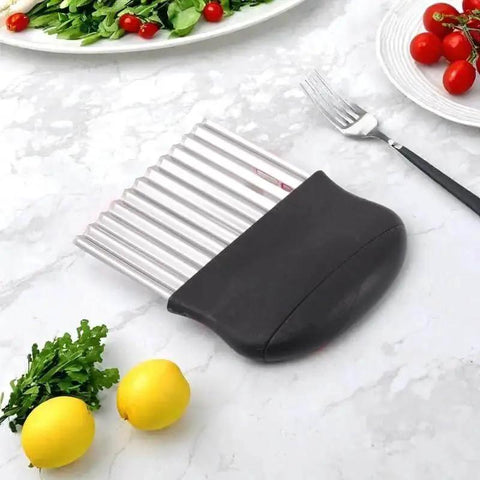 Crinkle Cutter Stainless Steel Potato Cutter And Veggie Slicer For Potatoes And Carrots with black handle on countertop