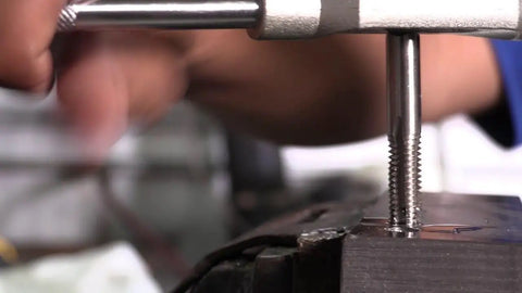 Person using Three Eighths Inch 16 UNC High Speed Steel Tap Set With Taper Plug And Bottom Style Taps For New Threads Or Retapping Damaged Threads