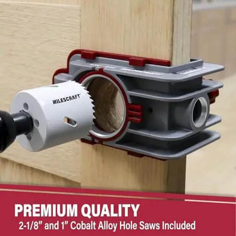 Close-up of Lock Mate Plus Self Clamping Professional Door Lock Installation Kit with cobalt hole saws on wooden door.