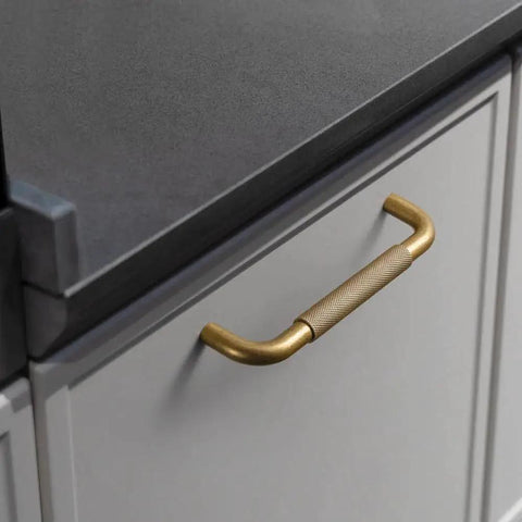 Six Pack 5 Inch Champagne Bronze Knurled Cabinet Pulls With Crosshatch Knurling for kitchen cabinets, showing a close-up installed view.