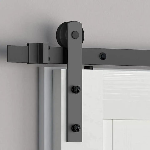 Close-up of Sliding Barn Door Roller Set Black I Shape Hanger Set Made From Carbon Steel with Black Powder Coat installed on door.