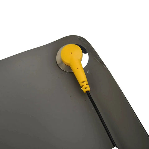 Close-up of the corner of an Anti Static ESD Grounding Mat Kit With Ground Wire For Electronics Workstation Repair, showing the grounding cord