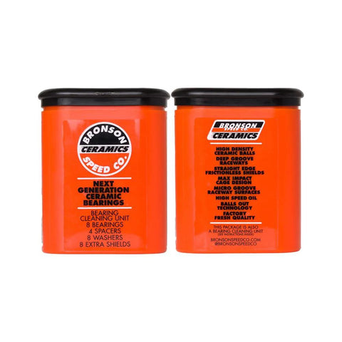 Bronson Speed Co ceramic skateboard bearings orange, pair of orange bearing containers with black lids.