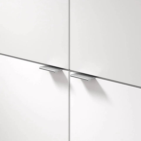 Lincoln Collection 1 5 16 Inch Center To Center Stainless Steel Modern Cabinet And Drawer Edge Pull Handle installed on white cabinets