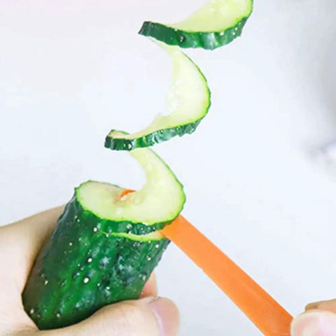 Green Spiral Slicer Portable Manual Kitchen Gadget For Cucumber Carrot And Potato Garnishes showing spiral cucumber slice