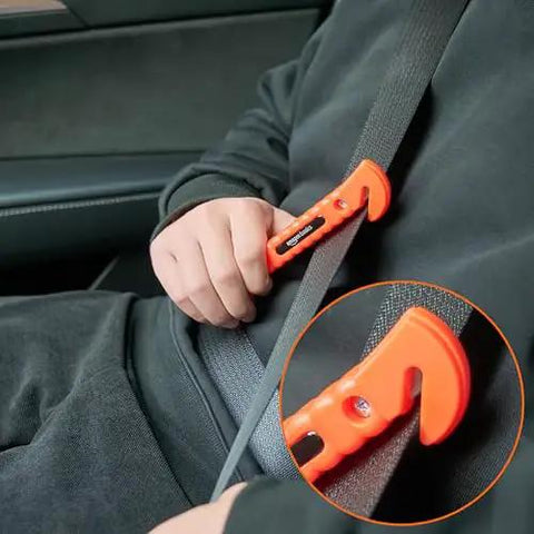 Emergency Car Escape Tool With Window Hammer And Seat Belt Cutter Two Pack Bright Orange Handle in use cutting seat belt.