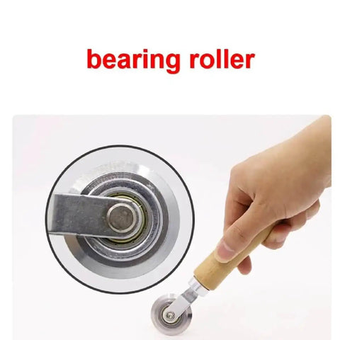 Pro Grade Box Resizer Tool With Solid Wood Handle And High Precision Bearing Roller, hand holding the roller for scoring cardboard