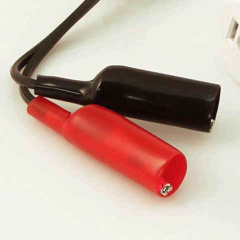Close-up of black and red metal test leads from the Fast Circuit Breaker Finder Kit For Quick Panel ID And Safe Wiring, ET310 Receiver.