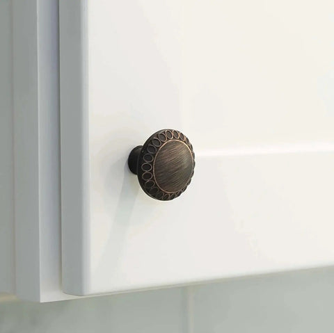 Ravenna Series Solid Traditional Kitchen Cabinet Pull Handle Knob One And One Quarter Inch Oil Rubbed Bronze on white cabinet