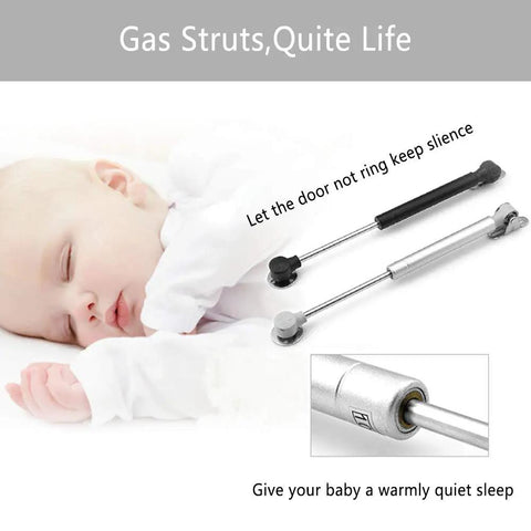 80N Heavy Duty Hydraulic Gas Struts 6 Pack Soft Close Lid Supports for Cabinets and Furniture shown beside a sleeping baby.