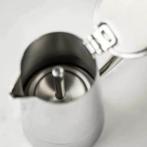 Open top view of a Stainless Steel Stovetop Espresso Maker for 6 cups, showing heat-resistant, non-reactive design for rich bold brew