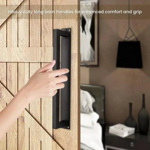 Rustic 12 Inch Barn Door Handle installed on a wooden door, heavy duty matte black square door pull with long flush base.