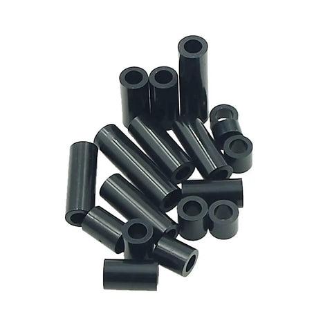 Black ABS Round Spacers Kit For M4 Screws, Unthreaded Standoffs, Metric 7Mm OD By 4.2Mm ID in various sizes laying on surface