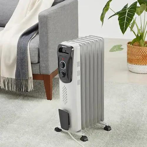 Cozy Up Fast With A Portable Oil Filled Radiator Heater From Amazon Basics With Three Heat Settings High 1500W Medium 1000W Low 600W Long Lasting Heat Seven Oil Filled Fins ETL Safety Tip Over Protection Indoor Use White