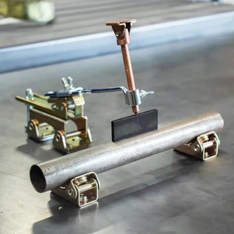 Deluxe Magnetic Grasshopper Welding Finger With Copper Spindle Magnetic V Pad Base And Anti Tipping Bolt Delivers Pinpoint Tack Weld Clearance On Round Square Flat And Angled Surfaces Brass Contacts For Stainless Jobs 7.5 Inch Strong Hand Tools installed on a pipe.