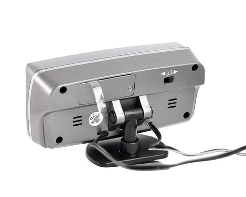 Rear view of 4 In 1 Car LED Clock Thermometer Voltmeter With Time Temperature 12V, showing mount and connection cables.