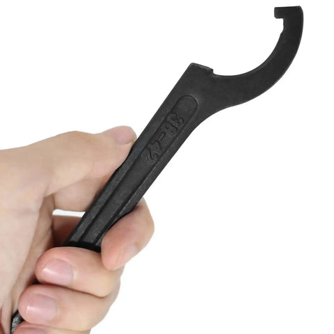 Hand holding C Hook Spanner Wrench Black Adjustable Hook Tool Carbon Steel Spanner Collet Chuck For 38-42mm Round Nut