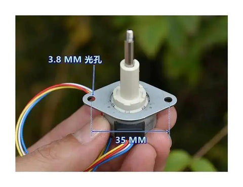 25mm Precision Linear Actuator For Stepper Motors, 20mm Stroke, 3.8mm mounting holes, wires shown, held in hand outdoors