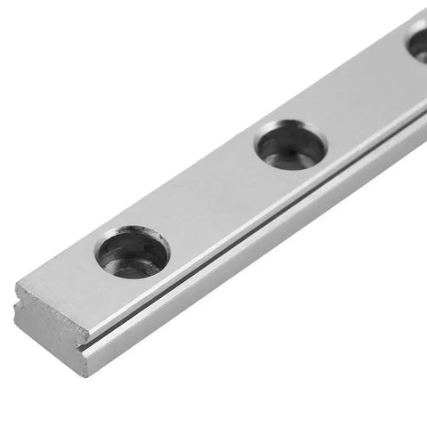 Close-up of Compact 200mm Linear Guide Rail With 9mm Wide Slide Block For Precision Equipment showcasing screw holes and metallic finish.