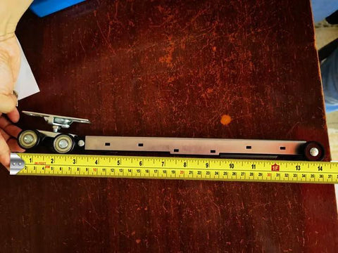 Workhorse Pocket Door Roller Kit With Soft Close, 120 Lbs Capacity, Three Wheel Pocket Door Hanger, shown with measuring tape