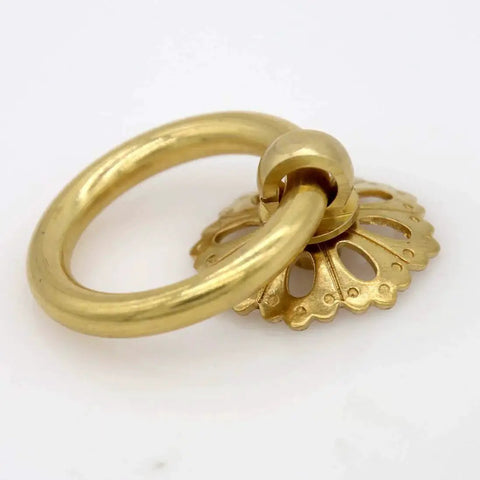 Close-up of a vintage gold brass ring pull with hollow dome base, flower-like design, part of a Set Of 6 Vintage Gold Brass Ring Pulls.