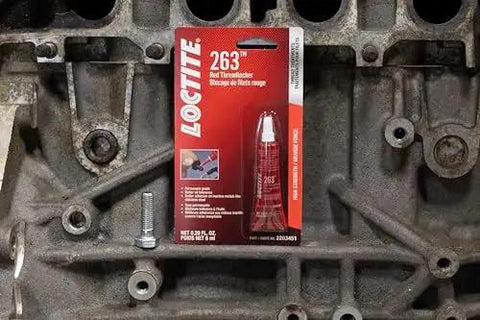 High Strength Automotive Threadlocker Red For Metal Fasteners That Stand Up To Heavy Vibration And Oil Exposure With Bright Fluorescent Finish For Easy Visual Verification In Tight Spaces 6 Ml 1 Pack Loctite package on engine block