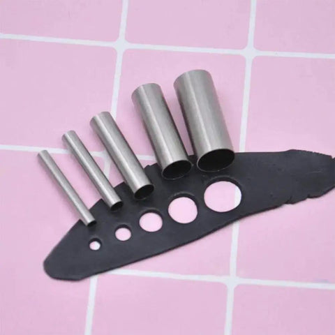 Clay Cutters Seven Piece Pro Grade Circle Cutter Set Stainless Steel Hollow Punches showing 5 sizes on a grid background.