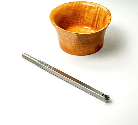90 Detailer Carbide Wood Lathe Turning Tool For Fine Detail Work Full Size Stainless Steel Unhandled USA Made By Harrison Specialties beside a wooden bowl