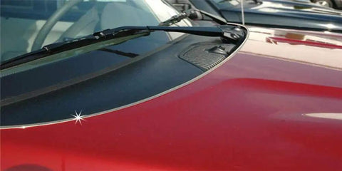 Close-up of installed Enhanced 18ft Chrome U Channel Edge Guard Trim For Door Edges And Bumpers on vehicle hood.