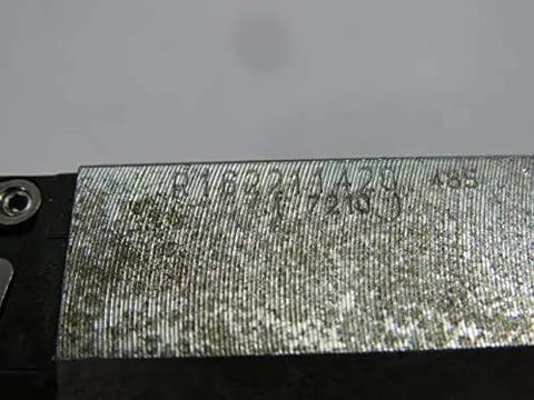 Close-up of 15 mm runner block with pulley and bushing, single linear slide unit R162211420, metal surface detail visible