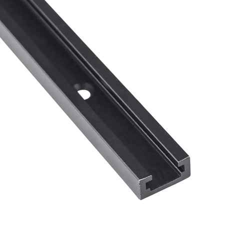 Close-up of a black anodized aluminum T-track, part of a 4 Piece 48 Inch Aluminum T Track Set For Woodworking Jigs And Fixtures With Screws.