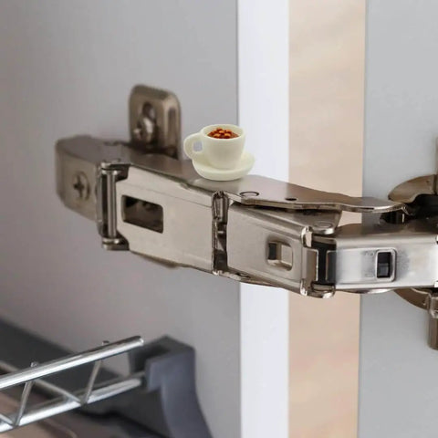Whimsical Hot Cocoa Door Hinge Topper installed on metal hinge, showcasing a mini cup design for cozy cottage decor.