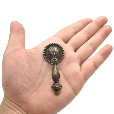 4 Pack Antique Drawer Pulls Vintage Bronze Finish Large Finger Pull Handles for Drawers Cabinets Desks and Jewelry Boxes shown in hand