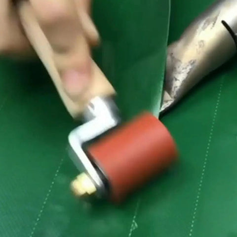 Heavy-duty silicone seam roller with a red 40mm roller and brass detail on a metal handle for PVC/TPO/EPDM roofing tape